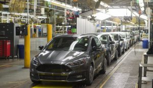 A lineup of Ford Focus vehicles on an assembly line in Wayne, Michigan. (Photo: SAUL LOEB/AFP/Getty Images)