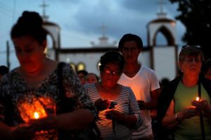 Mothers of missing sons came out of a service of Pedro Alberto Huesca, whose remains were found at one of the unmarked graves where skulls were found on a plot of land, in Palmas de Abajo, Veracruz, Mexico March 16, 2017. PHOTO: REUTERS/Carlos Jasso