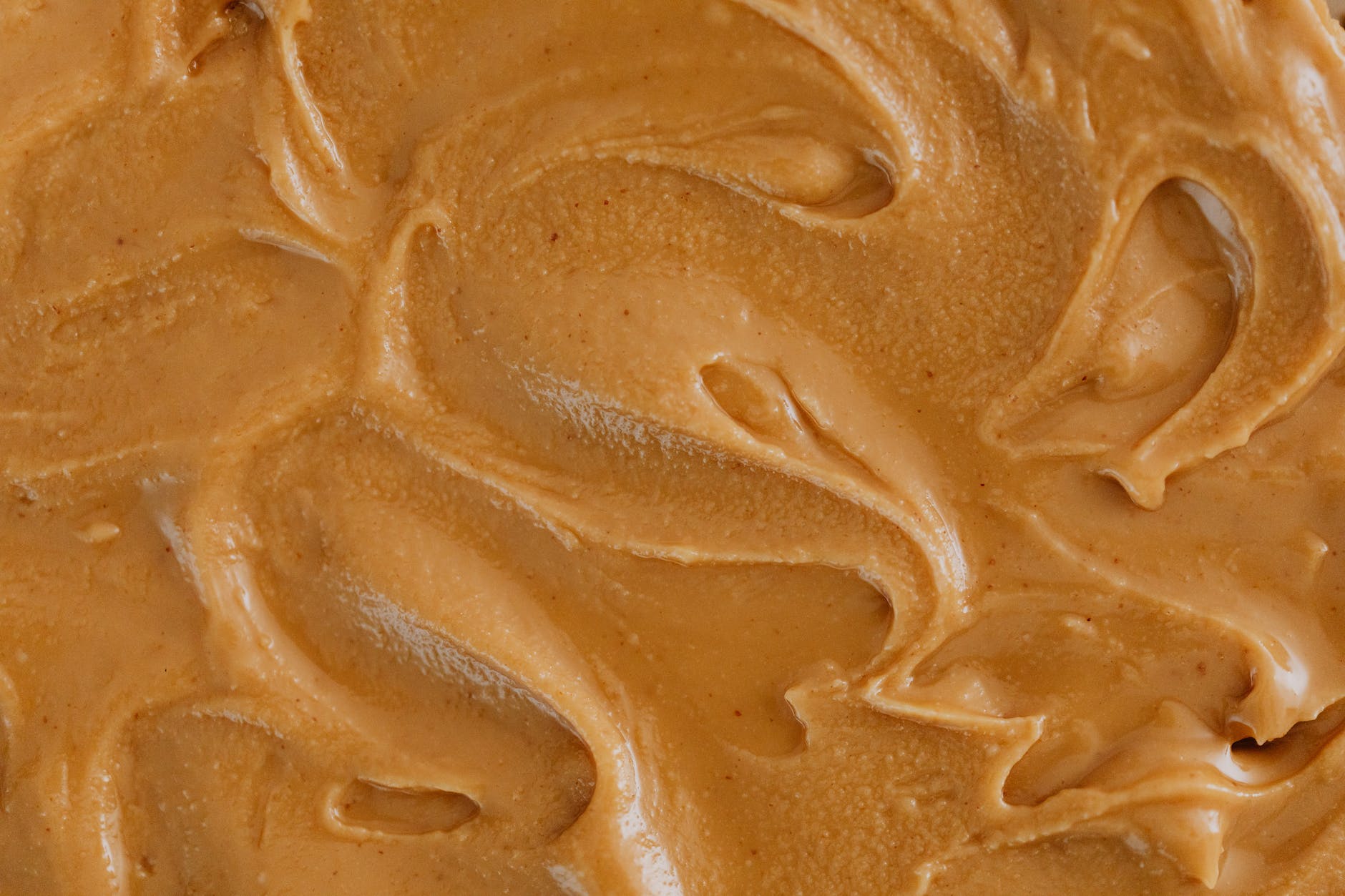 extreme close up photo of creamy peanut butter